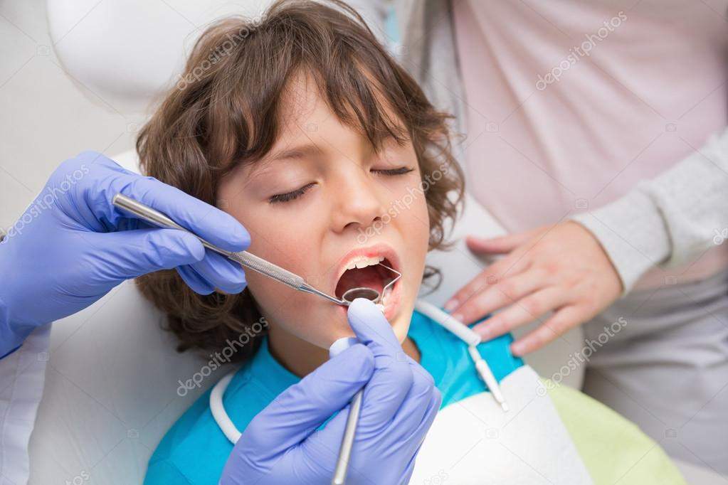 Baby receiving dental care from pediatric dentist for tooth decay prevention